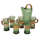 A SET OF SIX GREEN GLASS MUGS