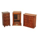 A MAHOGANY MINIATURE CHEST OF DRAWERS