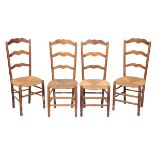 A SET OF FOUR COUNTRY LADDERBACK CHAIRS