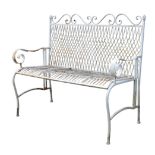 A WROUGHT-IRON WHITE PAINTED GARDEN BENCH