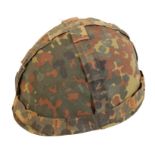 A CONTINENTAL CAMOUFLAGE ARMY HELMET