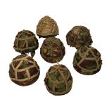 FIVE VARIOUS BRITISH ARMY HELMETS