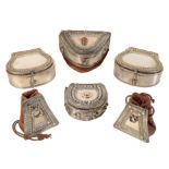 A COLLECTION OF MOROCCAN WHITE METAL AND LEATHER AMMO POUCHES
