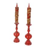 A PAIR OF CHINESE LACQUER AND PARCEL GILT CANDLESTICKS