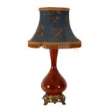 A 20TH CENTURY GLASS BALUSTER ELECTRIC TABLE LAMP