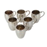 A SET OF SIX SILVER TOT CUPS