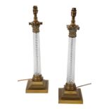 A PAIR OF BRASS MOUNTED TABLE LAMPS