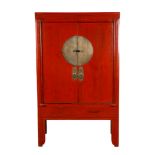 A CHINESE RED LACQUER CUPBOARD