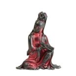 A CHINESE RED 'LACQUER' SEATED GUANYIN