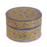 A CHINESE CANTON ENAMEL FAMILLE ROSE YELLOW-GROUND CIRCULAR BOX AND COVER