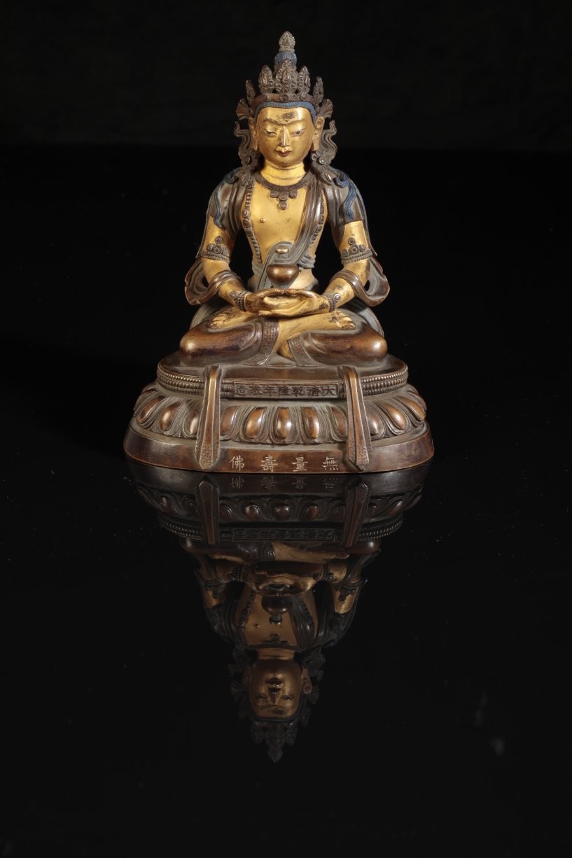 A CHINESE COLD PAINTED AND GILT BRONZE FIGURE OF AMITAYUS