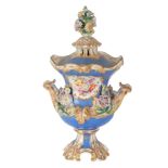AN EARLY 19TH CENTURY ENGLISH FLORAL ENCRUSTED PORCELAIN TWO HANDLED URN AND COVER