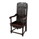 A 17TH CENTURY STYLE OAK ARMCHAIR