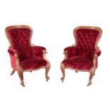 A PAIR OF VICTORIAN WALNUT SPOON BACK ARMCHAIRS