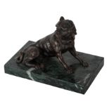 A BRONZE MODEL OF A RECLINING HOUND