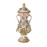 AN EARLY 19TH CENTURY ENGLISH FLORAL ENCRUSTED PORCELAIN TWO HANDLED VASE AND COVER