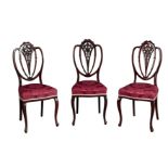 A SET OF SEVEN EDWARDIAN MAHOGANY DINING CHAIRS OF HEPPLEWHITE DESIGN