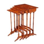 A NEST OF FOUR EDWARDIAN SATINWOOD AND EBONY STRUNG 'QUARTETTO' TABLES