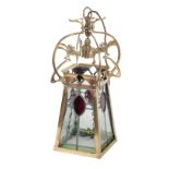 AN ART NOUVEAU BRASS AND STAINED GLASS HANGING LANTERN