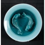 ALAN WHITE FOR POOLE POTTERY: A BLUE GLAZED CARP BOWL