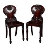 A PAIR OF VICTORIAN MAHOGANY HALL CHAIRS