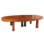 AN IMPRESSIVE WALNUT AND CROSSBANDED EXTENDING DINING TABLE