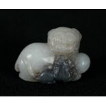 A CHINESE WHITE/PALE CELADON BUDDHISTIC LION AND CUB