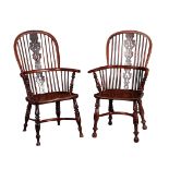 A MATCHED PAIR OF 19TH CENTURY YEW WOOD AND ELM WINDSOR ARMCHAIRS