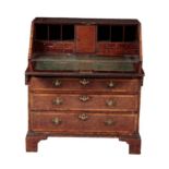 A GEORGE III WALNUT, CROSS BANDED AND BRASS STRUNG BUREAU