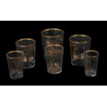 A GRADUATED SET OF SIX EARLY 19TH CENTURY GILDED GLASS TUMBLERS