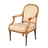 A VICTORIAN SATINWOOD, PARCEL-GILT AND POLYCHROME ARMCHAIR