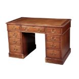 AN EDWARDIAN MAHOGANY KNEEHOLE DESK