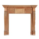 A CARVED PINE AND PARCEL GILT FIRE SURROUND IN THE STYLE OF WILLIAM KENT