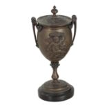 A BRONZE TWO-HANDLED CUP AND COVER