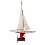 AN EARLY 20TH CENTURY 10 R CLASS POND YACHT AND STAND