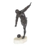A LARGE BRONZE MODEL OF A RUGBY PLAYER