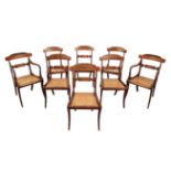 A SET OF EIGHT REGENCY DARK-STAINED BEECH DINING-CHAIRS