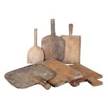 A GROUP OF SIX RUSTIC BREAD AND CHEESE BOARDS