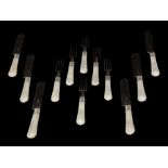 A SET OF SIX VICTORIAN MOTHER OF PEARL HANDLED FRUIT KNIVES & FORKS