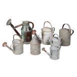 SIX VINTAGE WATERING CANS
