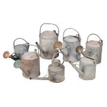 A GROUP OF SEVEN VINTAGE WATERING CANS