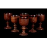 A SET OF SIX YEW WOOD WINE GOBLETS