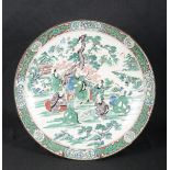 A CHINESE FAMILLE VERTE PORCELAIN CHARGER
