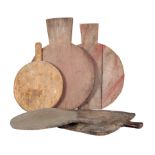 A GROUP OF FIVE RUSTIC CHOPPING BOARDS