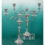 A PAIR OF ELIZABETH II SILVER THREE SCONCE CANDLEBRA OF NEO-CLASSICAL DESIGN