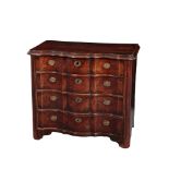 AN EARLY 18TH CENTURY CONTINENTAL WALNUT AND OAK SERPENTINE FRONTED COMMODE