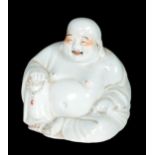 A BLANC DE CHINE PORCELAIN MODEL OF A BUDDHA