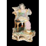 A 19TH CENTURY BLOOR DERBY PORCELAIN FIGURE OF A CHILD IN AN ARMCHAIR