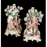 A PAIR OF 18TH CENTURY DUESBURY & CO DERBY PORCELAIN CANDLESTICKS - A DOMESTIC COUPLE