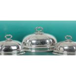 A SET OF THREE 19TH CENTURY SILVER PLATED GRADUATED OVAL CLOCHES